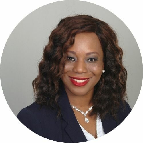 Tawanda L. Hines headshot with curly brown hair and black suit with white top